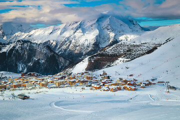 Fototapeta na wymiar Ski resort with colorful buildings and high mountains, France, Europe