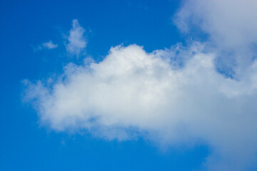 Soft white clouds and blue sky background.