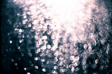 Beautiful abstract shiny sparkling bokeh background in blue tones.