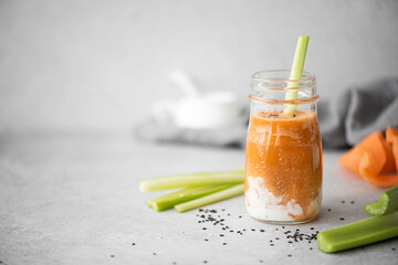 carrot smoothie with sour cream and sesame seeds