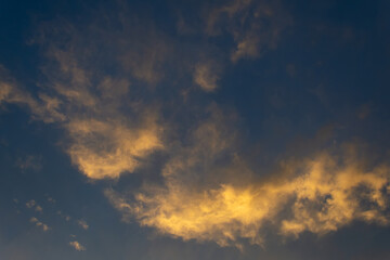 Beautiful cloud at sunset. Close-up. Backgrounds. Textures.
