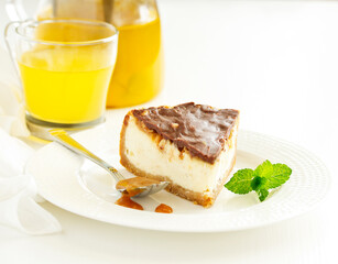 Slice of cheesecake with caramel and nuts. Selective focus.