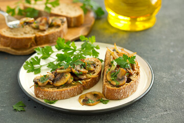Bruschetta with fried mushrooms with onions and parsley.