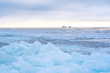 Winter landscape of frozen lake. Seasons, climate change, ecology, environment. Extremely cold winter. Lake Baikal, Russia