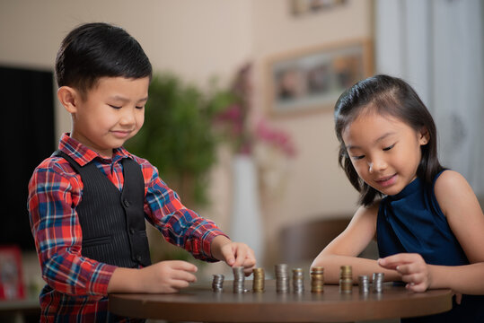 Asian children, managing finances, counting money
