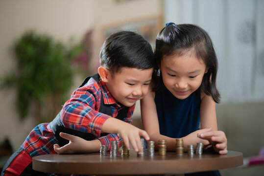 Asian children, managing finances, counting money
