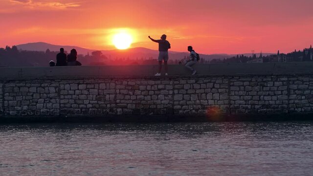 People watching sunset, Corfu Island, Greece.