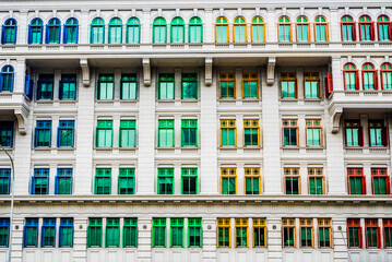 Fototapeta premium Rainbow coloured window frames on a facade 