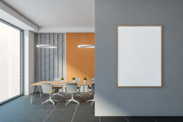 Orange and gray office meeting room with poster
