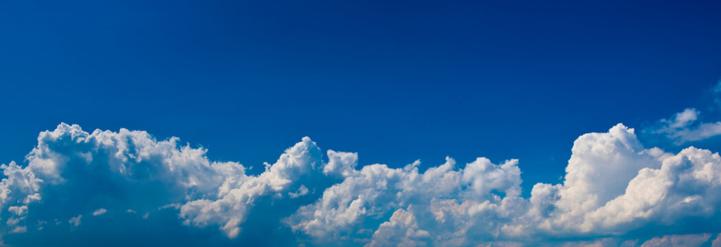 fluffy white clouds and blue sky © E.O.