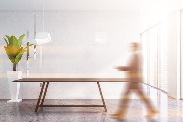 Man walking in white dining room