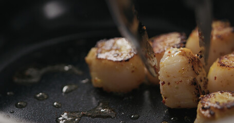 turn scallops on a ceramic pan