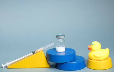 Periodic vaccination, syringe ampules, with child toys. Protection against viruses, rubella, chickenpox, measles, covid-19