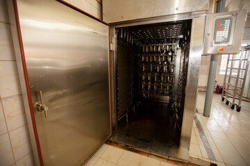 Industrial smoking of fish. Mackerel in a smoking oven.