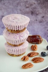 Vegan mini blueberry cheesecake ice cup with pecan date crust