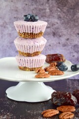 Vegan mini blueberry cheesecake ice cup with pecan date crust