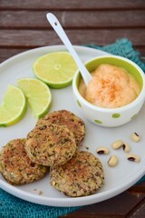 Delicious quinoa jalapeño bean burger patties with chili mayonnaise dip garnish with lime