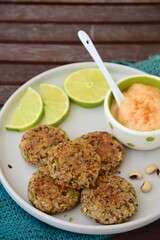 Delicious quinoa jalapeño bean burger patties with chili mayonnaise dip garnish with lime