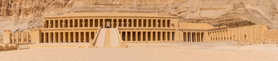 Fototapeta premium View of the Mortuary Temple of Hatshepsut without people on the way back from tourism in Luxor after the coronavirua pandemic, Egypt