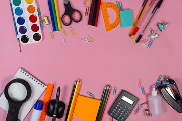 school supplies on a pink background