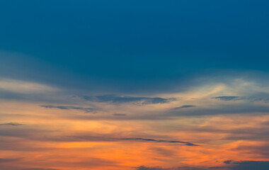 Naklejka na ściany i meble Beautiful orange clouds in the sunset sky