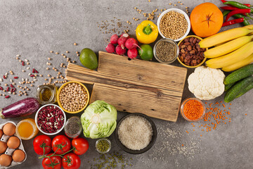 Balanced vegetarian diet organic food background. food for healthy nutrition, superfoods, vegetarian options. vegetables, fruits, greens, cereals, top view
