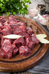 Beef stew prepared on a chopping board.