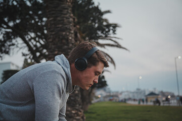 man listening to music with headphones