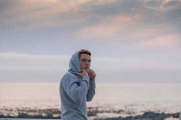 Fitness portrait on young man at the sea