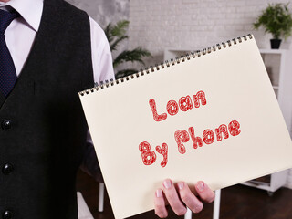 Business concept about Loan By Phone with sign on the page.