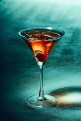 Alcoholic drink with ice on a light table