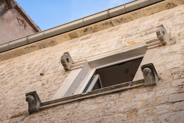Old window in medieval house of Kotor, Montenegro