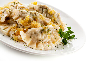 Dumplings - noodles with meat on white background