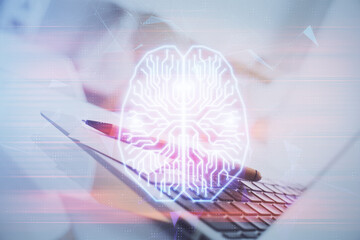 Double exposure of work space with computer and human brain drawing hologram. Brainstorm concept.
