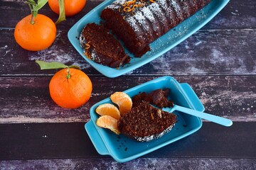 Chocolate almond clementine cake garnish with powdered sugar and zest