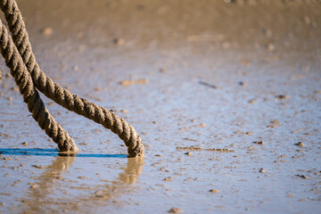 Rope leading into mud at an obstacle course race