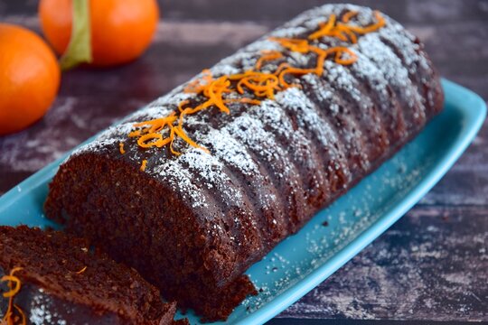 Chocolate Almond Clementine Cake Garnish With Powdered Sugar And Zest