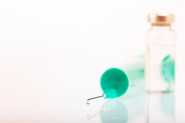 Vaccine vial dose flu shot drug needle syringe. Concept of treatment in a hospital, medical...