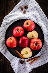 Red ripe apples on wooden table