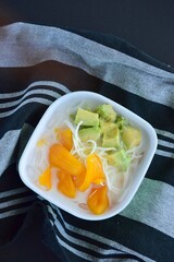 Es Teler is a fruit cocktail from Indonesia. Avocado, coconut meat and jackfruit served with coconut milk, sweetened condensed milk, syrup.