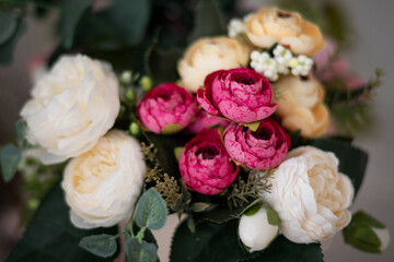 Bright bouquet of roses, peonies and buttercups floral background