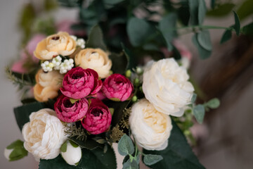 Bright bouquet of roses, peonies and buttercups floral background