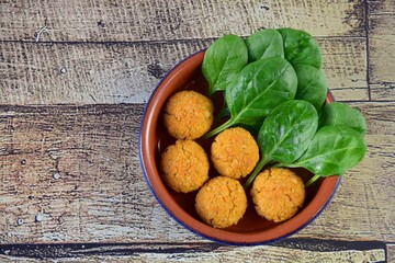 Traditional Lebanese food falafel with spinach, healthy vegan food. Flat lay, negative space