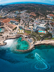 Beautiful aerial view over Protaras beaches with crystal clear turquoise water and sandy  beach. Perfect summer vacation in Protaras, Cyprus. 