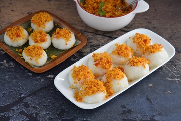 Ketan Serundeng. Indonesian cuisine. Savory steamed cake of glutinous rice with coconut milk, topped with spicy roasted desiccated coconut