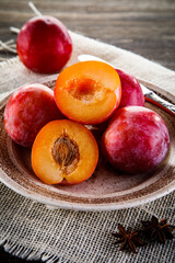 Ripe plums on wooden table
