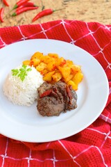 Sambal goreng hati kentang or hot spicy liver and potatoes, Indonesian traditional cuisine served with rice. Typically served during Eid Al-Fitr celebration