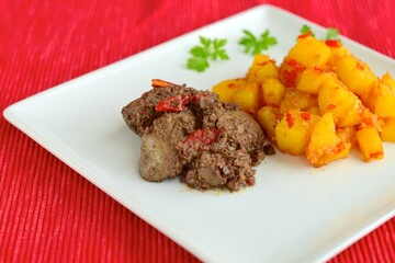 Sambal goreng hati kentang or hot spicy liver and potatoes, Indonesian traditional cuisine served on plate. Typically served during Eid Al-Fitr celebration