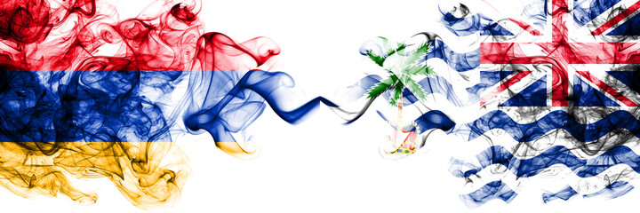 Armenia vs British, Britain, Indian Ocean Territory smoky mystic flags placed side by side. Thick colored silky abstract smoke flags