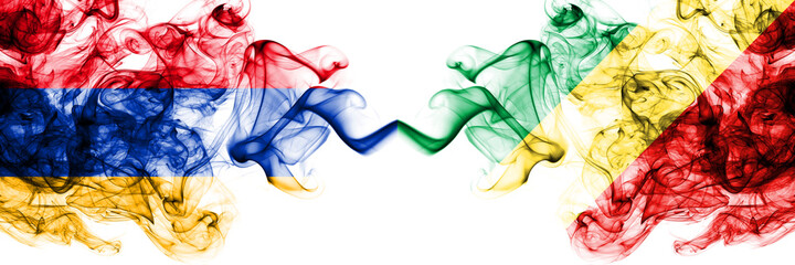 Armenia vs Congo, Congolese smoky mystic flags placed side by side. Thick colored silky abstract smoke flags